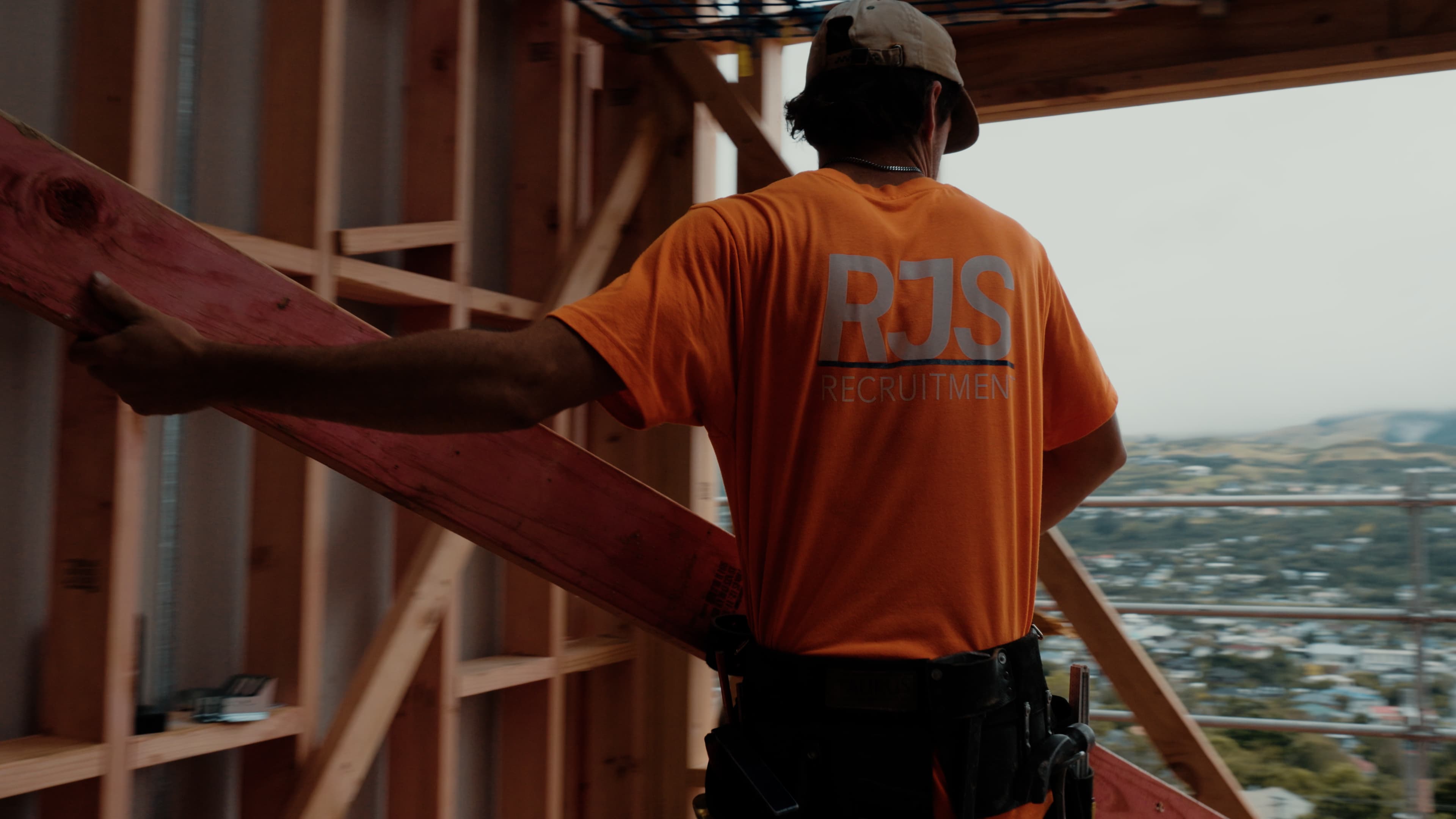 Construction worker using a circular saw on site