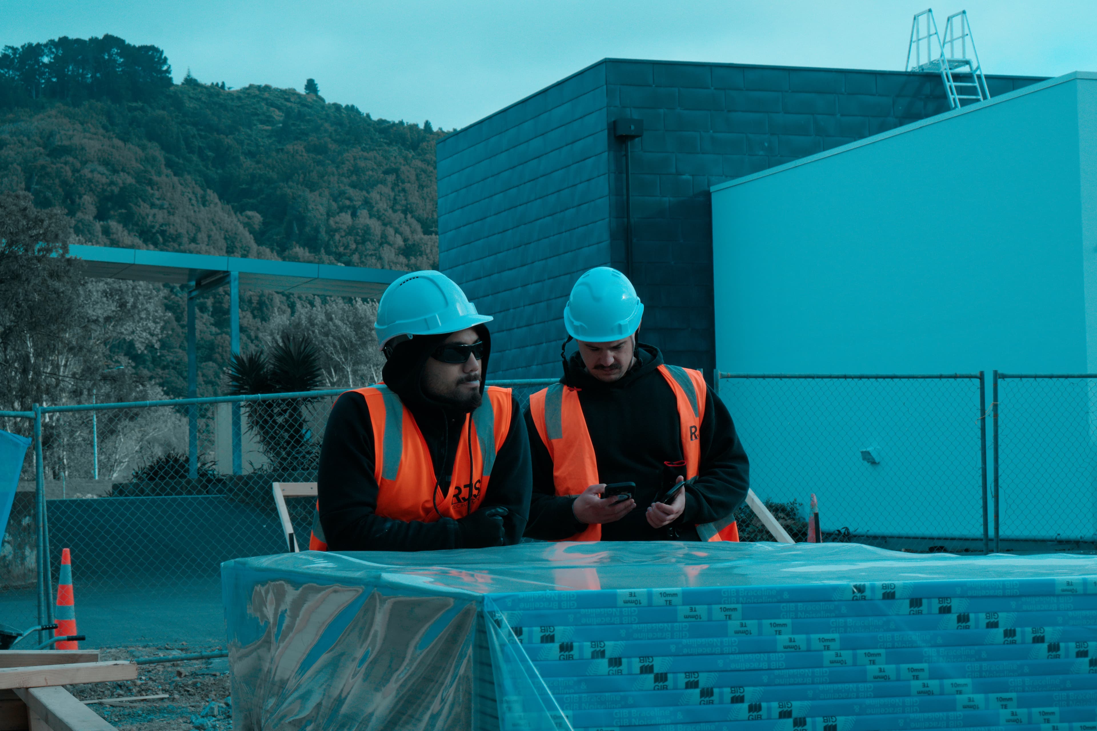 RJS Recruitment workers reviewing plans on site